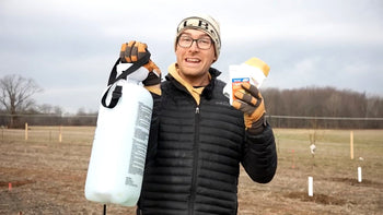 A man getting ready to spray trees with dormant oil. 