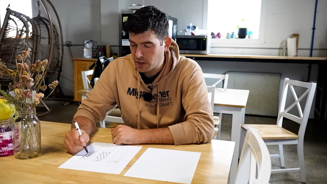 A man doing garden planning.
