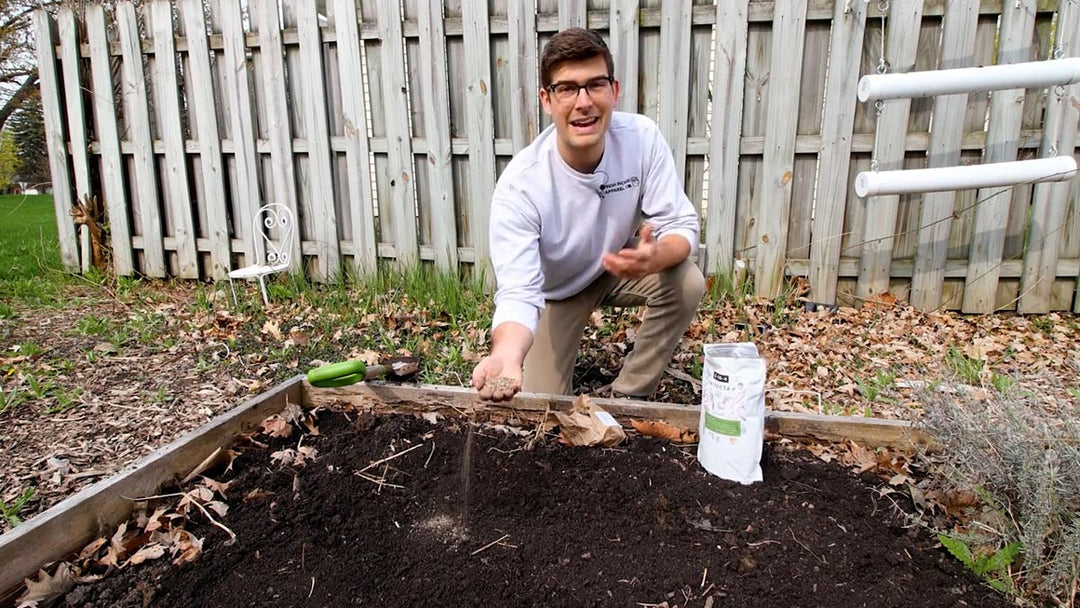A man explaining how to add nitrogen to soil. 