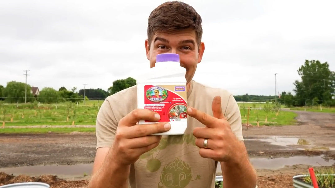 A man excitedly pointing at an organic pesticide.