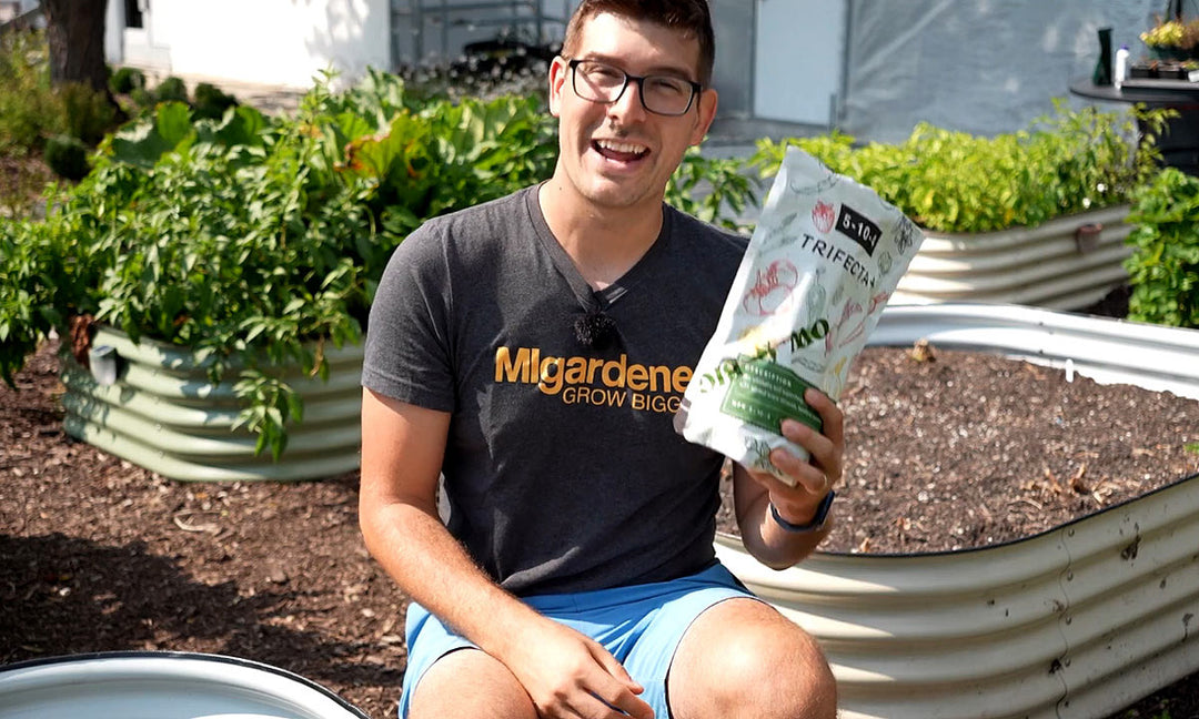 A man using Trifecta fertilizer in a garden.
