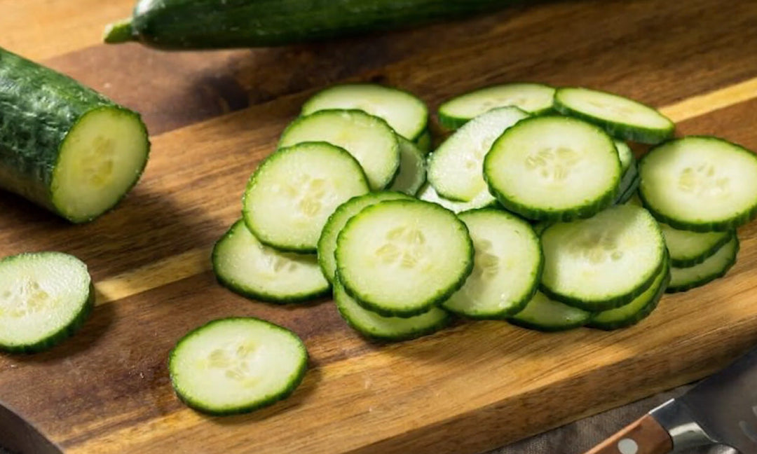 Fresh cucumbers on a cutting board.