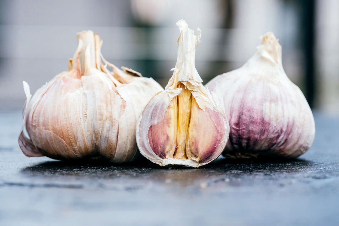 Healthy, raw, organic garlic cloves on a table.